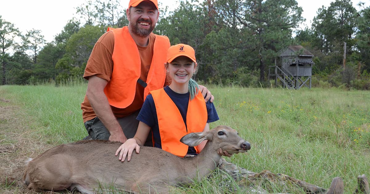 The author and his young daughter with a deer taken on a Georgia WMA.
