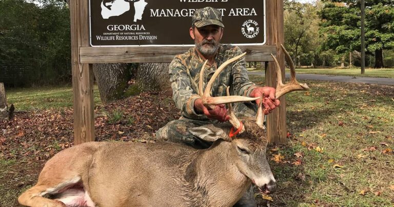 Hunter with a large Georgia buck taken on public land.